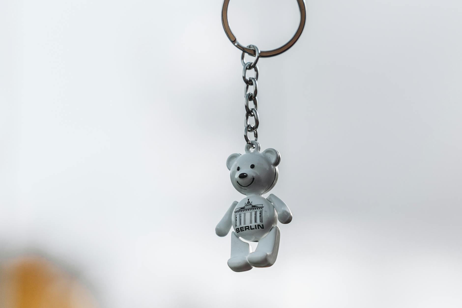 A keychain with a teddy bear on it