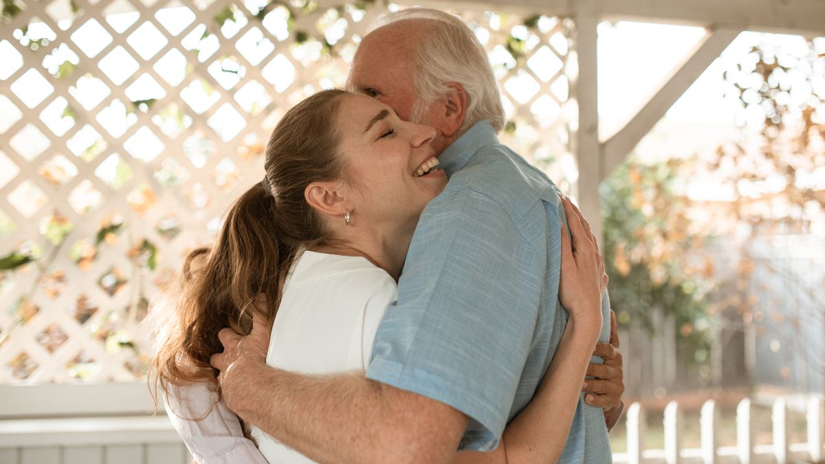 age gap in a relationship - old man hugging young girl